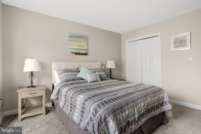 bedroom featuring a closet, carpet, and baseboards