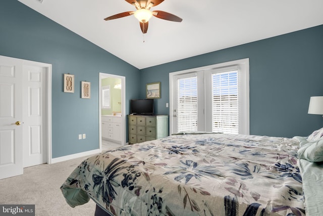 carpeted bedroom with lofted ceiling, ceiling fan, ensuite bath, and baseboards