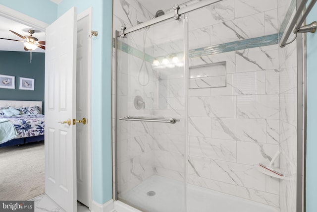 full bath featuring marble finish floor, a shower stall, ceiling fan, and connected bathroom