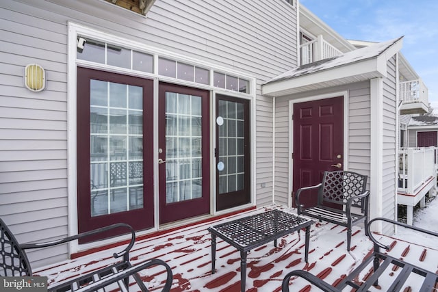 view of snow covered property entrance