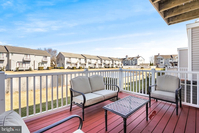 deck with a residential view and outdoor lounge area