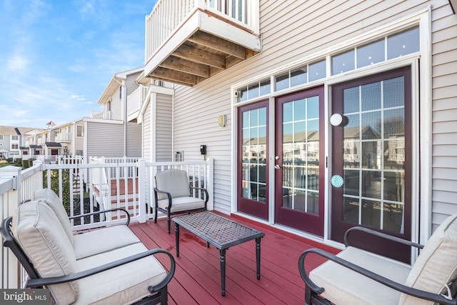 wooden terrace featuring french doors and a residential view