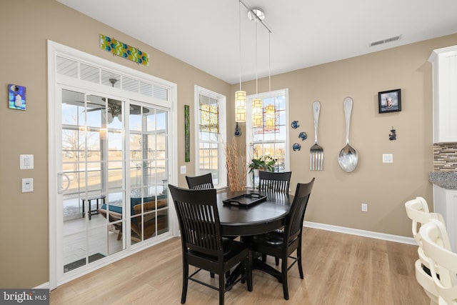 dining room featuring light wood-type flooring