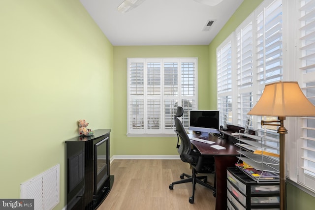 home office featuring light hardwood / wood-style flooring