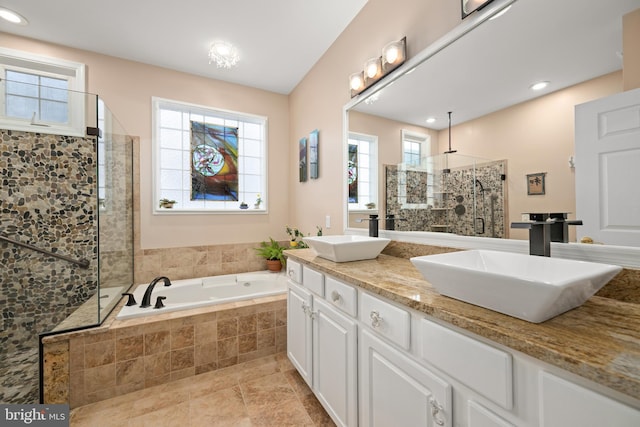 bathroom with vanity and independent shower and bath