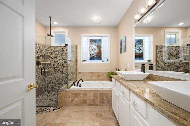 bathroom with vanity and plus walk in shower