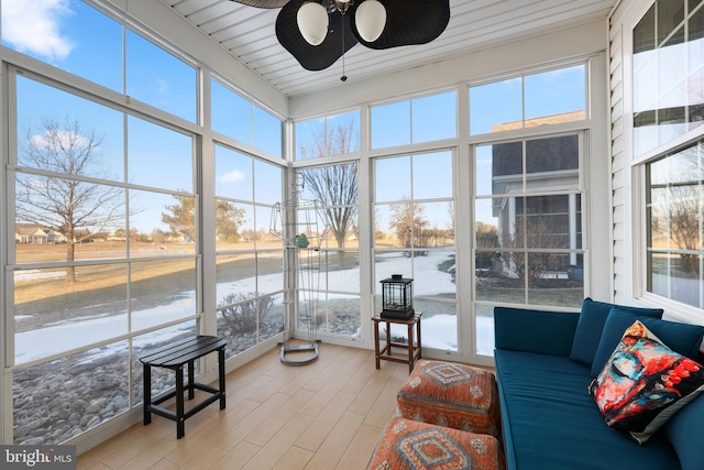 sunroom featuring ceiling fan