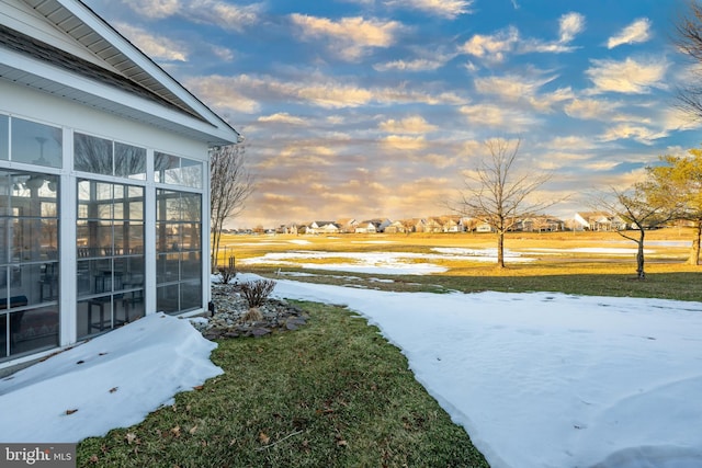 view of yard layered in snow