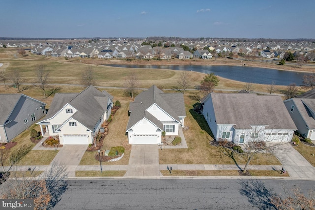 drone / aerial view featuring a water view