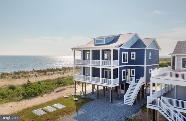 back of house featuring a water view