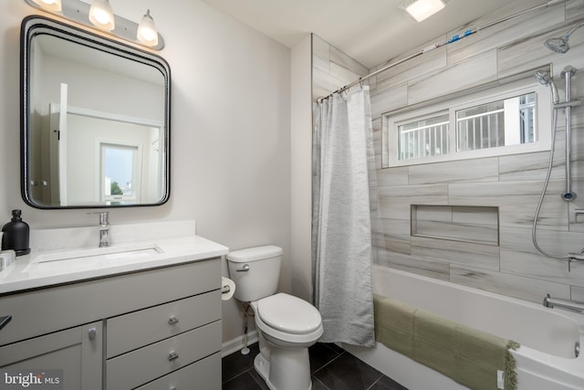 full bathroom featuring vanity, shower / bath combo, tile patterned floors, and toilet