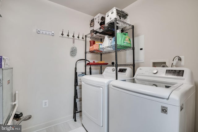 washroom featuring washing machine and clothes dryer