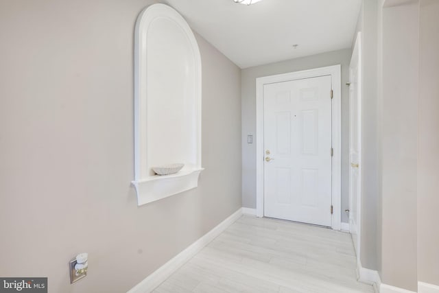 doorway to outside featuring light wood-type flooring