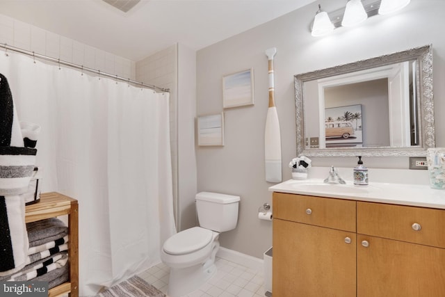 bathroom with tile patterned floors, vanity, and toilet