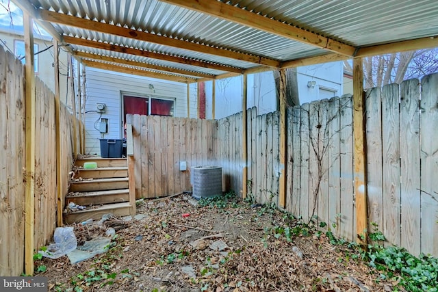 view of patio / terrace featuring central AC unit and a fenced backyard