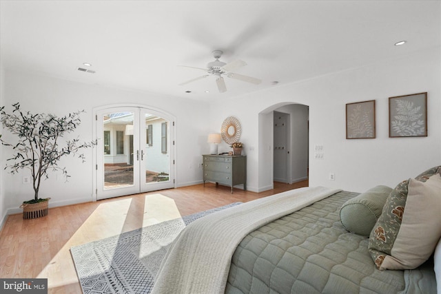 bedroom with french doors, ceiling fan, access to exterior, and light hardwood / wood-style floors