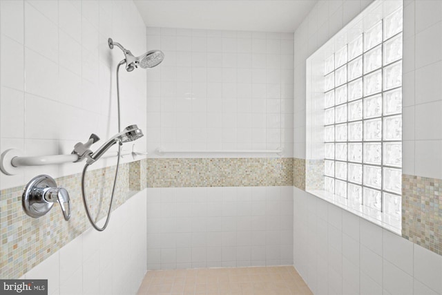 bathroom with tiled shower