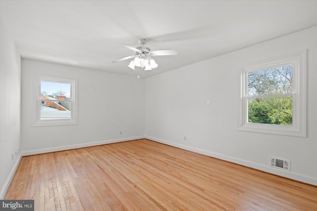 unfurnished room featuring ceiling fan and light hardwood / wood-style floors