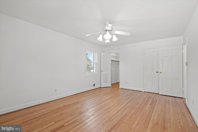 unfurnished bedroom featuring ceiling fan and light hardwood / wood-style floors