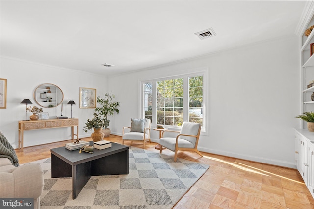 living room with ornamental molding and light parquet flooring