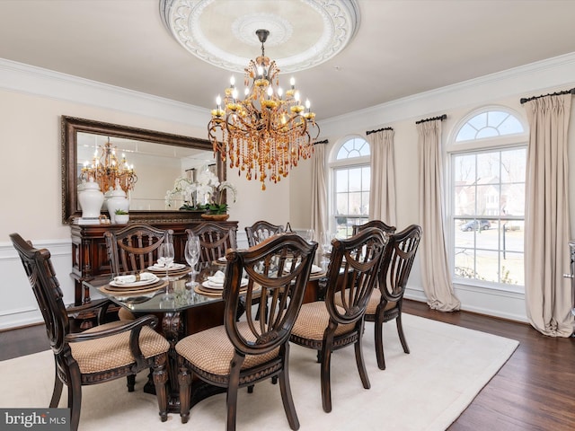 dining room featuring an inviting chandelier and crown molding