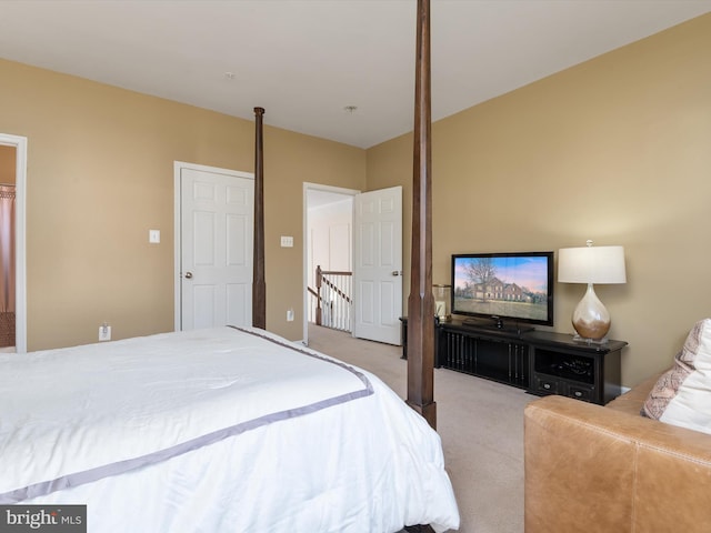 bedroom featuring light carpet