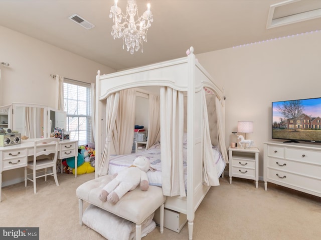 bedroom with light carpet and an inviting chandelier