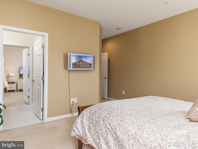 bedroom featuring light colored carpet