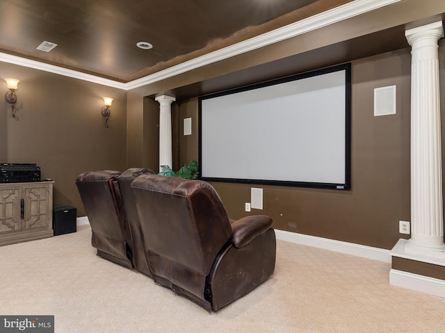 carpeted cinema room with ornamental molding and decorative columns