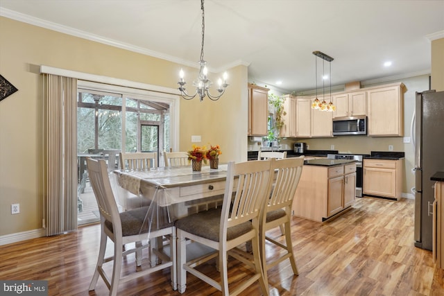 dining room with light hardwood / wood-style flooring and ornamental molding