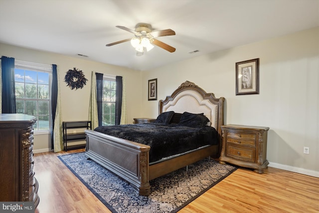 bedroom featuring hardwood / wood-style flooring and ceiling fan