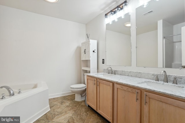 bathroom featuring vanity, a bath, and toilet