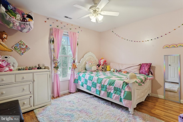 bedroom featuring ceiling fan and light hardwood / wood-style flooring