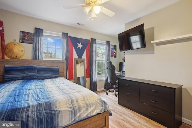 bedroom featuring ceiling fan and light hardwood / wood-style flooring