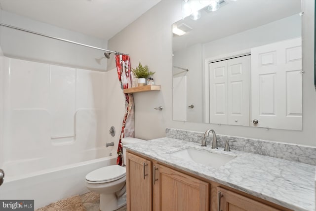 full bathroom with vanity, toilet, and shower / tub combo