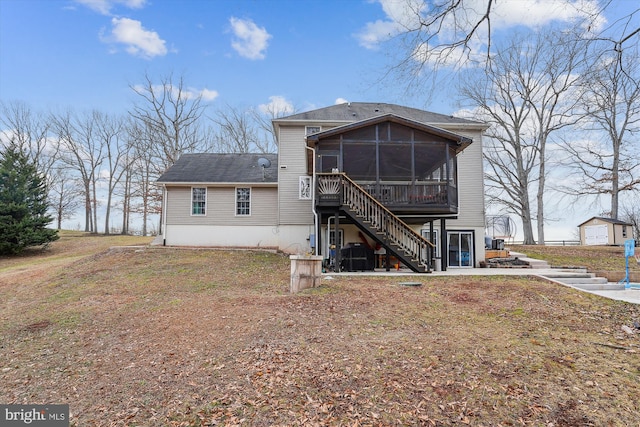 back of house with a sunroom