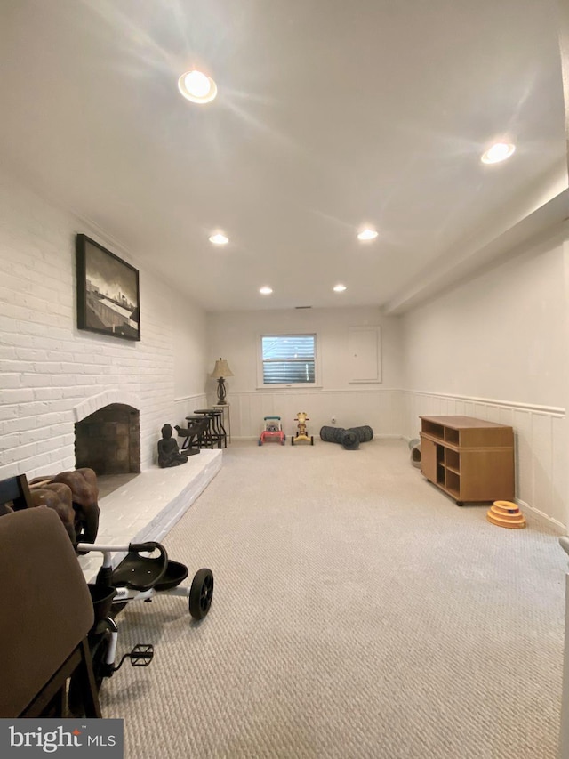 workout area featuring carpet, a fireplace, and recessed lighting