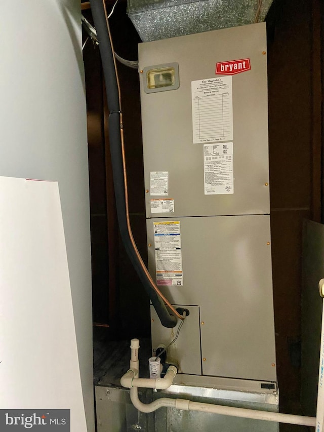 utility room with heating unit