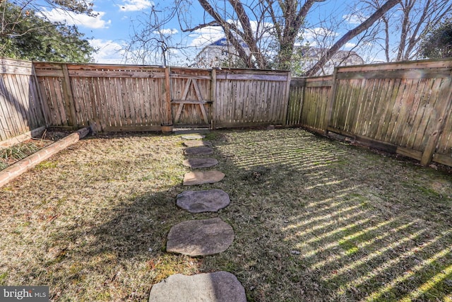 view of yard featuring a fenced backyard