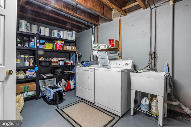 clothes washing area with laundry area and washing machine and dryer