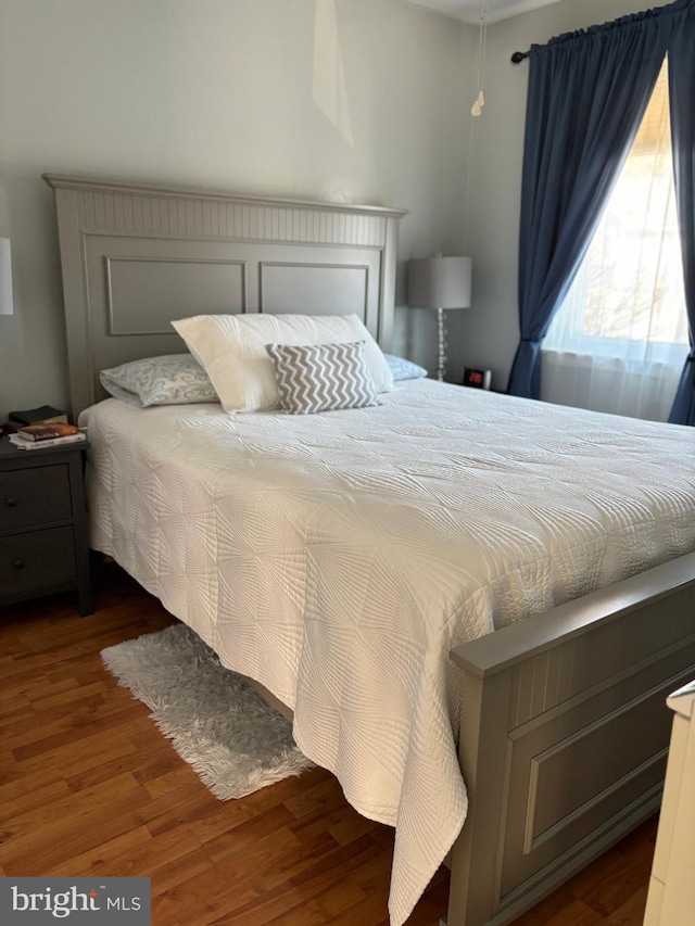 bedroom featuring dark wood-type flooring