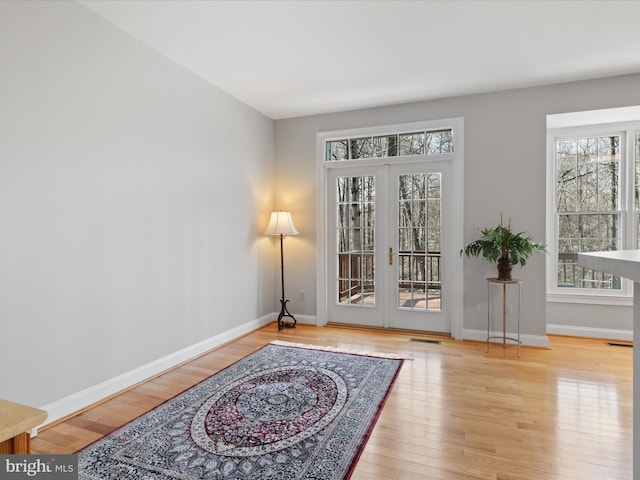 doorway featuring light hardwood / wood-style flooring and french doors