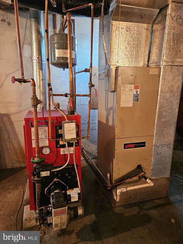 utility room featuring heating unit