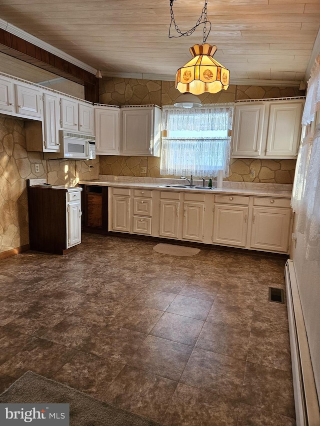 kitchen featuring sink, white cabinets, decorative light fixtures, a baseboard radiator, and wooden ceiling