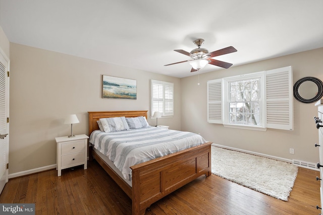 bedroom featuring dark hardwood / wood-style floors and ceiling fan