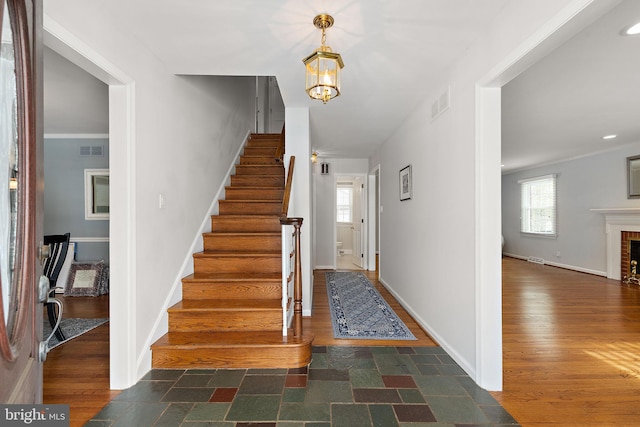 staircase with wood-type flooring