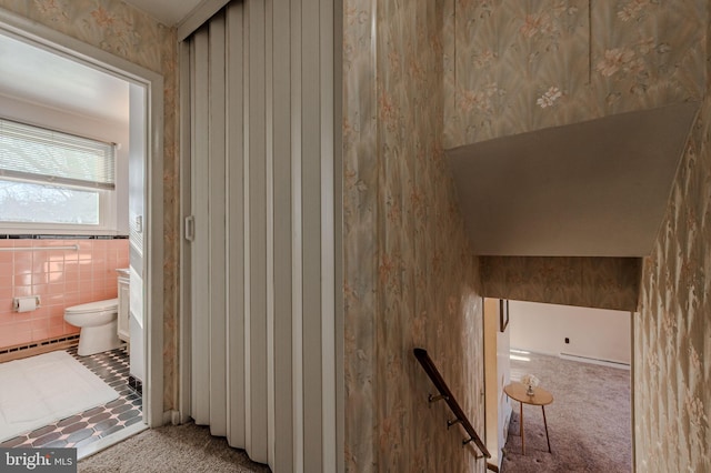 1 Keats Dr, Claymont, DE 19703 - stairway featuring tile walls, a baseboard heating unit, and carpet floors