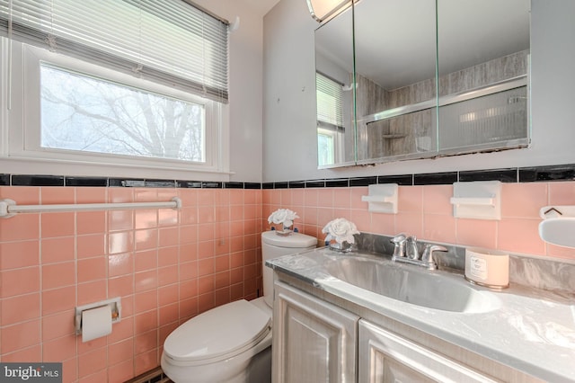 1 Keats Dr, Claymont, DE 19703 - bathroom featuring tile walls, vanity, toilet, and an enclosed shower