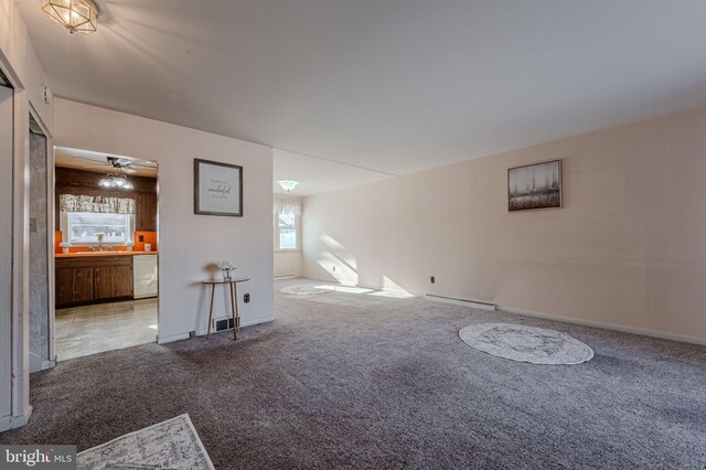 1 Keats Dr, Claymont, DE 19703 - unfurnished living room featuring ceiling fan, carpet flooring, sink, and baseboard heating