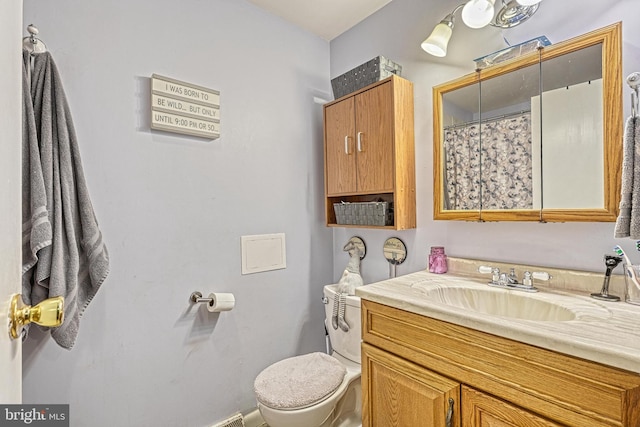 bathroom with vanity and toilet